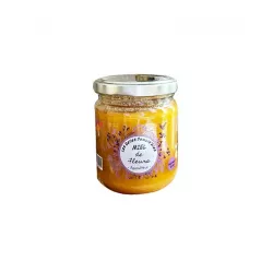 Tartine de pain frais garnie de Miel de Fleurs, illustrant une délicieuse façon de savourer ce produit artisanal